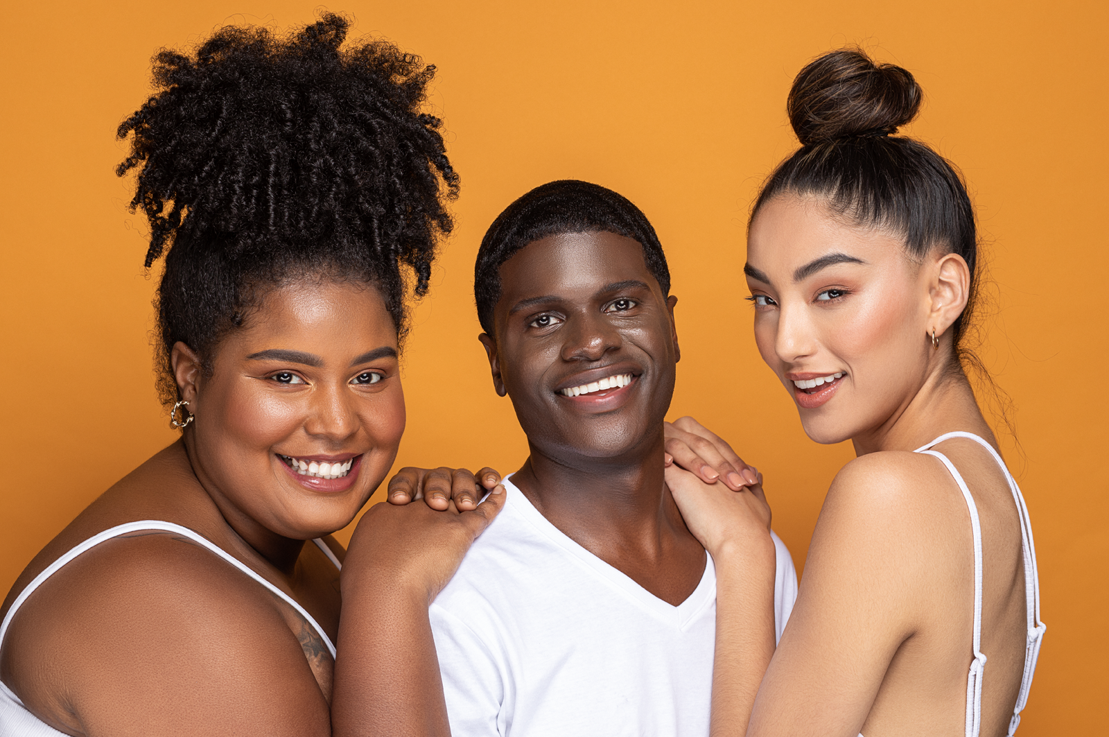 Two female models and one male model in the middle. All three models have different melanin shades. The models represent diversity, which is what ANIN Actives stands for.